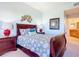 Bedroom with a queen-size bed and ensuite bathroom access at 5300 S Atlantic Ave # 17-506, New Smyrna Beach, FL 32169