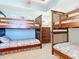 Second bedroom with two bunk beds for extra sleeping space at 5300 S Atlantic Ave # 17-506, New Smyrna Beach, FL 32169