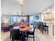 Dining room features a round wooden table and six chairs at 5300 S Atlantic Ave # 17-506, New Smyrna Beach, FL 32169