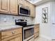 Kitchen boasts granite countertops and stainless steel appliances at 5300 S Atlantic Ave # 17-506, New Smyrna Beach, FL 32169