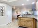 Open kitchen with granite island and breakfast bar at 5300 S Atlantic Ave # 17-506, New Smyrna Beach, FL 32169