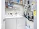 Convenient laundry room with washer, dryer, and ample storage at 5300 S Atlantic Ave # 17-506, New Smyrna Beach, FL 32169