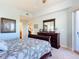 Main bedroom with a sleigh bed, dresser and ocean view at 5300 S Atlantic Ave # 17-506, New Smyrna Beach, FL 32169