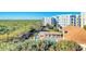 Community pool and spa with lush landscaping and boardwalk access at 5300 S Atlantic Ave # 17-506, New Smyrna Beach, FL 32169
