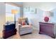 Relaxing sitting area featuring a comfy chair and coastal-themed decor at 5300 S Atlantic Ave # 17-506, New Smyrna Beach, FL 32169