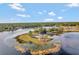Aerial view showcasing a tranquil island with a gazebo and lake access at 535 Valley Stream Dr, Geneva, FL 32732