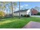 Large backyard with detached garage and wooden deck at 535 Valley Stream Dr, Geneva, FL 32732