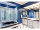 Bathroom with double vanity, a large soaking tub, and window at 535 Valley Stream Dr, Geneva, FL 32732