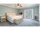 Main bedroom with king-size bed and French doors at 535 Valley Stream Dr, Geneva, FL 32732