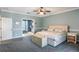 Main bedroom with king bed and access to bathroom at 535 Valley Stream Dr, Geneva, FL 32732