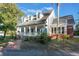 Two story home with a large porch and blue shutters at 535 Valley Stream Dr, Geneva, FL 32732