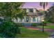 Two-story house with blue shutters, a porch, and a brick walkway at 535 Valley Stream Dr, Geneva, FL 32732