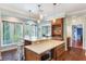 Island kitchen with stainless steel appliances and tile flooring at 535 Valley Stream Dr, Geneva, FL 32732