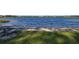 Peaceful lakefront view with picnic table and grassy area at 535 Valley Stream Dr, Geneva, FL 32732