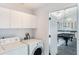 Laundry room with washer, dryer, and cabinets at 535 Valley Stream Dr, Geneva, FL 32732
