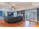 Spacious living room with hardwood floors, fireplace, and french doors at 535 Valley Stream Dr, Geneva, FL 32732