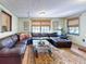 Relaxing living room featuring a sectional sofa and a brick fireplace at 622 Yupon Ave, New Smyrna Beach, FL 32169