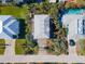 Overhead view of beach house with driveway and surrounding landscape at 6244 S Atlantic Ave, New Smyrna Beach, FL 32169