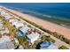 Aerial view of beach house and surrounding neighborhood at 6244 S Atlantic Ave, New Smyrna Beach, FL 32169