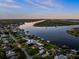 Wide shot of the property and its surroundings, including waterways at 73 Cunningham Dr, New Smyrna Beach, FL 32168