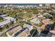 High-angle view of a residential neighborhood near the coastline with multiple buildings and trees at 742 Laurel Bay Cir, New Smyrna Beach, FL 32169