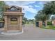 The Hunt Club community entrance with brick pillars and signage at 914 Fruitwood Pl, Port Orange, FL 32127