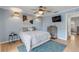 Bedroom with light blue walls, ceiling fan, and a dresser at 101 N Pine St # 7, New Smyrna Beach, FL 32169