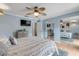 Bright bedroom with light blue walls, a comfortable bed, and ample closet space at 101 N Pine St # 7, New Smyrna Beach, FL 32169