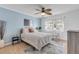Bedroom featuring a queen-size bed and two accent chairs at 101 N Pine St # 7, New Smyrna Beach, FL 32169