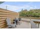 Relaxing deck with wooden privacy wall and seating area at 101 N Pine St # 7, New Smyrna Beach, FL 32169