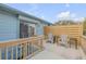 Outdoor deck with seating, overlooking trees at 101 N Pine St # 7, New Smyrna Beach, FL 32169
