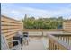 Private deck with two chairs and a small table at 101 N Pine St # 7, New Smyrna Beach, FL 32169