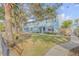 Light blue two-story building with a well-maintained lawn and walkway at 101 N Pine St # 7, New Smyrna Beach, FL 32169