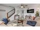 Living room with comfortable seating, a TV, and a modern clock at 101 N Pine St # 7, New Smyrna Beach, FL 32169