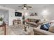 Living room featuring a sectional sofa and a large TV at 101 N Pine St # 7, New Smyrna Beach, FL 32169
