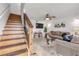 Wooden staircase with a modern metal railing leading upstairs at 101 N Pine St # 7, New Smyrna Beach, FL 32169