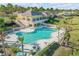 Community pool with surrounding lounge chairs at 125 Links Terrace Blvd, Daytona Beach, FL 32124