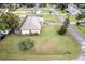 House with backyard, large grassy area, and surrounding neighborhood at 1331 Umbrella Tree Dr, Edgewater, FL 32132