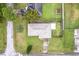 Overhead view showcasing a house, driveway, and spacious backyard at 1331 Umbrella Tree Dr, Edgewater, FL 32132