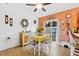 Dining area with yellow tablecloth and white chairs at 1331 Umbrella Tree Dr, Edgewater, FL 32132
