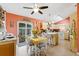 Bright kitchen with an island and white cabinets at 1331 Umbrella Tree Dr, Edgewater, FL 32132