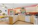 Eat-in kitchen with island, plenty of counter space, and modern appliances at 1331 Umbrella Tree Dr, Edgewater, FL 32132