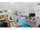 Relaxing living room features plush seating and large windows offering natural light at 1331 Umbrella Tree Dr, Edgewater, FL 32132
