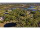 Aerial view of large lot with mature trees and ponds at 1390 Tumblin Dr, New Smyrna Beach, FL 32168