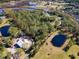 Aerial view of waterfront property with two ponds at 1390 Tumblin Dr, New Smyrna Beach, FL 32168