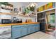 Kitchen with blue cabinets, wood countertop and built-in microwave at 141 Green Heron Ct, Daytona Beach, FL 32119