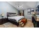 Spacious main bedroom with a king-size bed and a ceiling fan at 141 Green Heron Ct, Daytona Beach, FL 32119