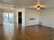 Spacious living room with tile floors, sliding doors to patio, and kitchen view at 1493 Providence Blvd, Deltona, FL 32725