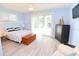 Bedroom with light blue walls, sliding doors, and anchor bedding at 152 Coleman St, Edgewater, FL 32141