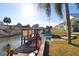 Private boat dock with covered slip and spacious seating area at 152 Coleman St, Edgewater, FL 32141